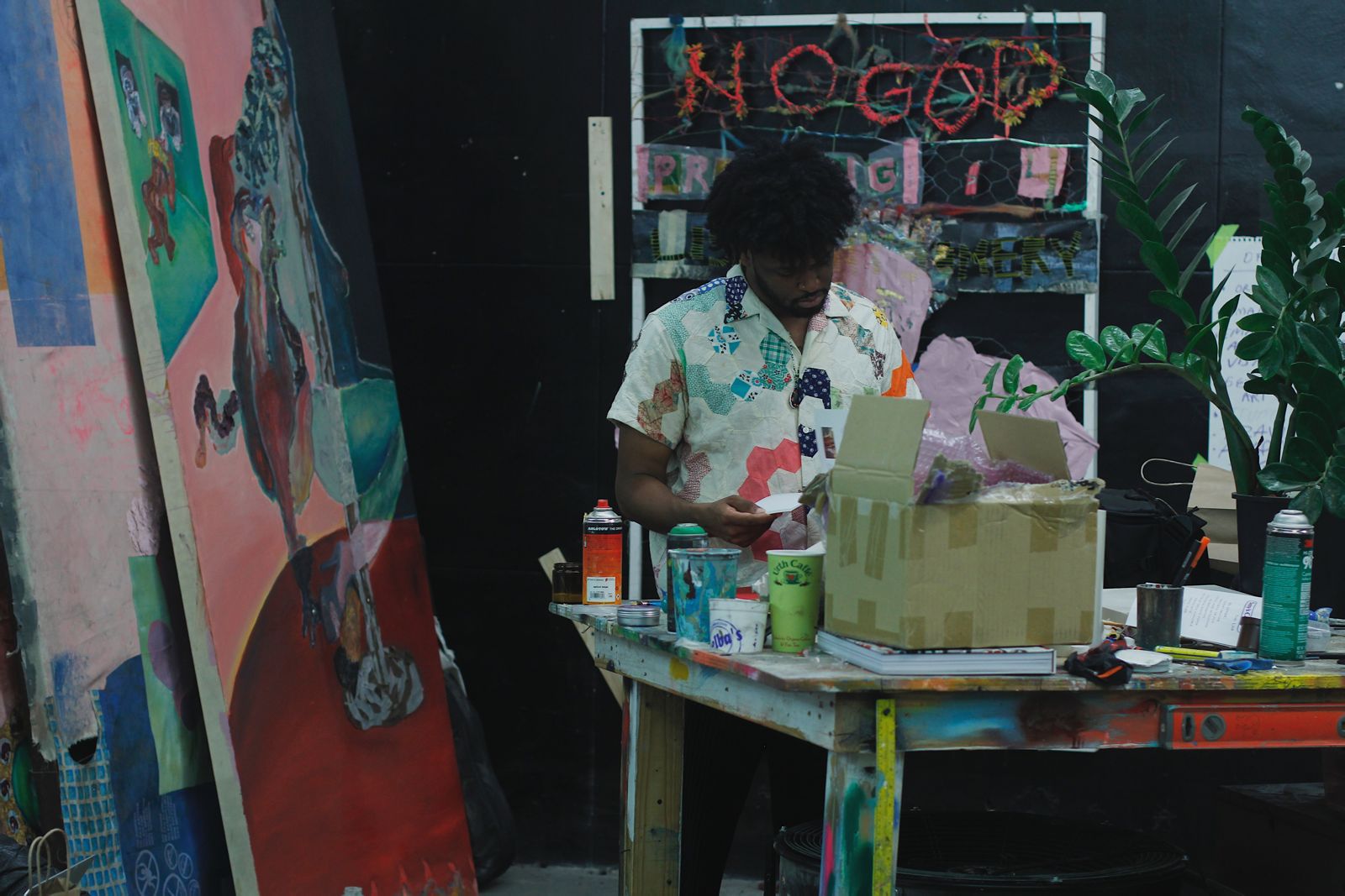 An artist painting in a studio