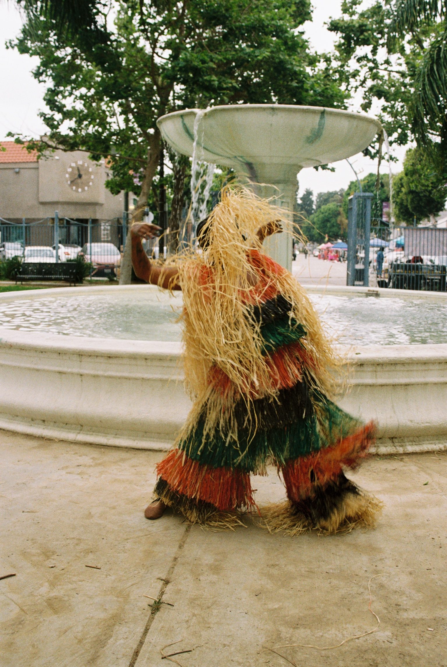 Egun Egun dancing in front of the Leimert Plaza fountain